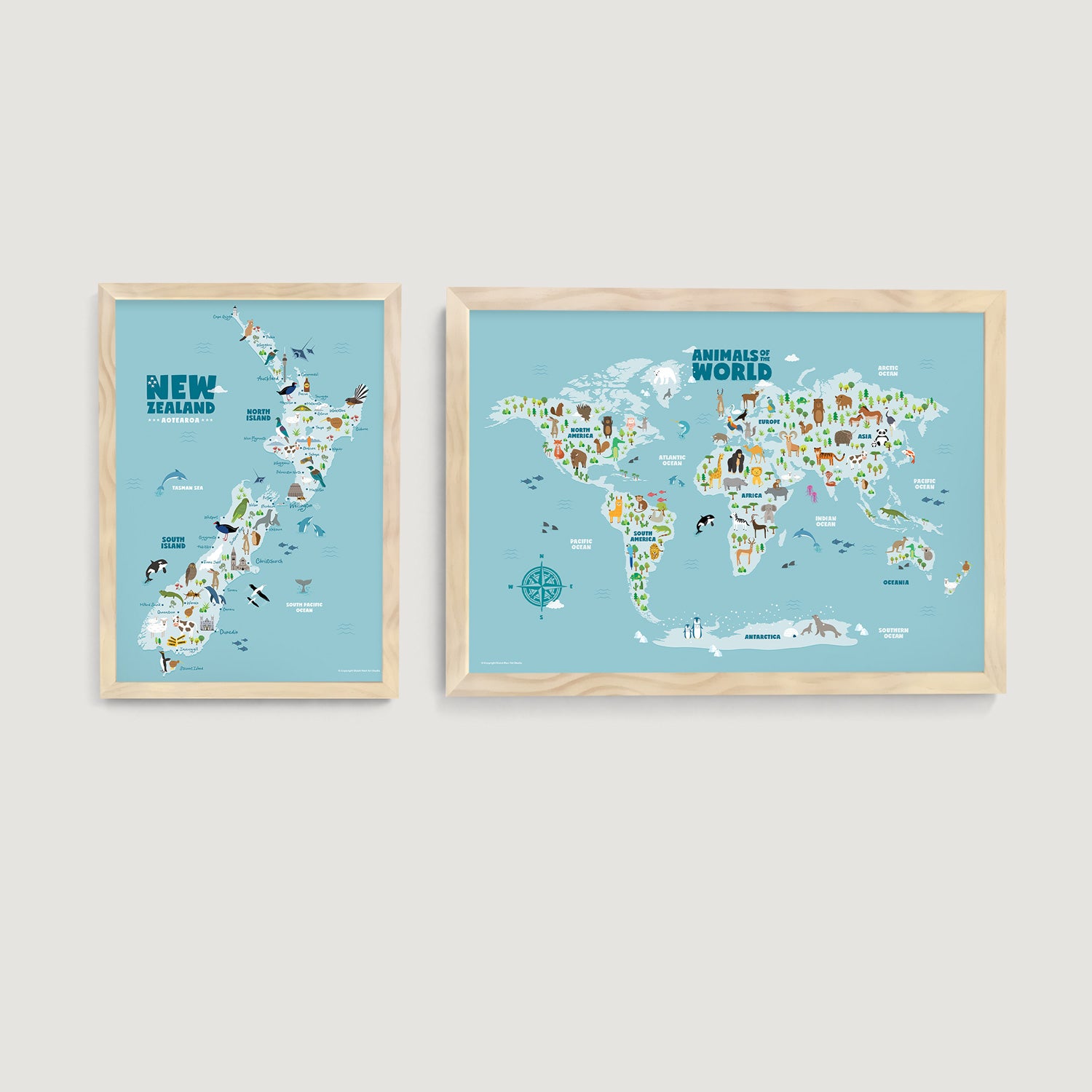 Two framed kids and nursery wall art prints of animals of the world map and New Zealand landmark and animals on a white wall  - Bluish Nest Art Studio