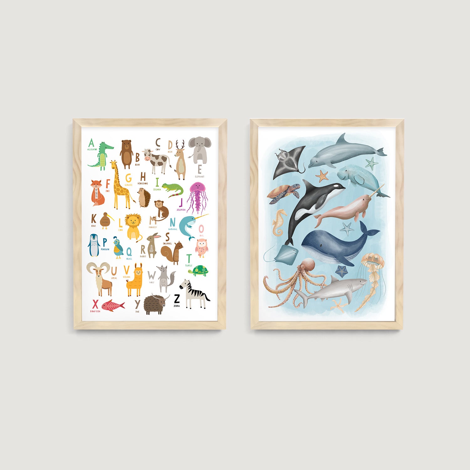 Two framed children and kids wall art prints on a wall, one with colorful animals and alphabet, the other with sea creatures  - Bluish Nest Art Studio