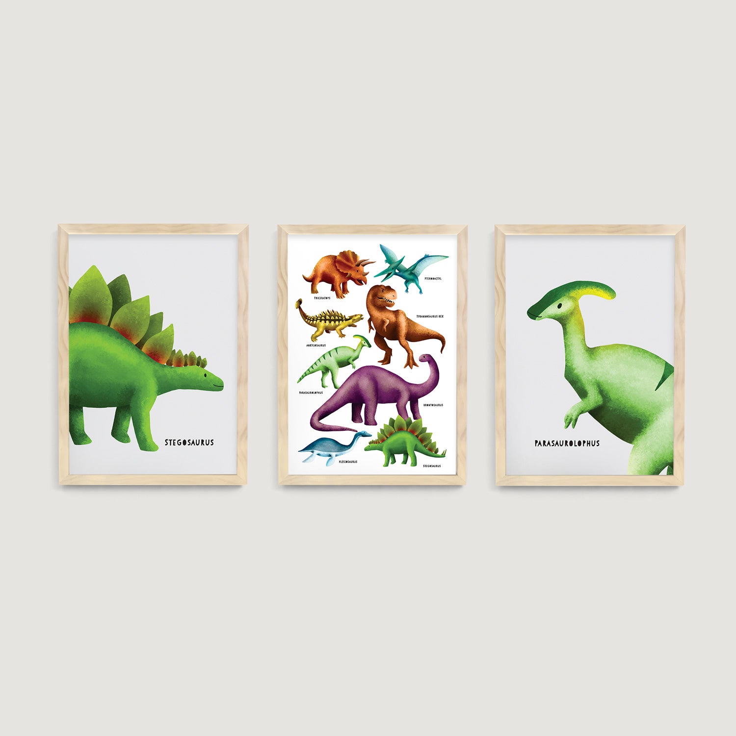 Three framed baby, nursery and kids wall art prints of stegosaurus, parasaurolophus and dinosaurs on a white wall  - Bluish Nest Art Studio