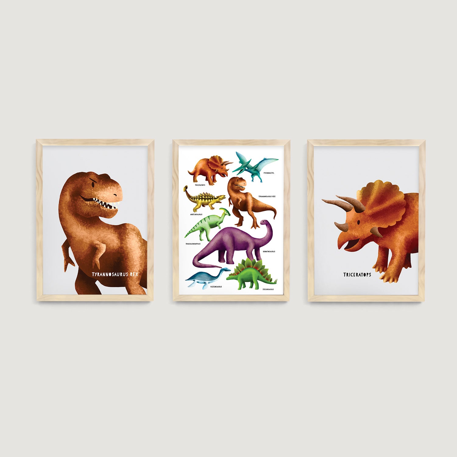 Three framed children and nursery wall art prints of dinosaurs on a light gray wall decor - Bluish Nest Art Studio