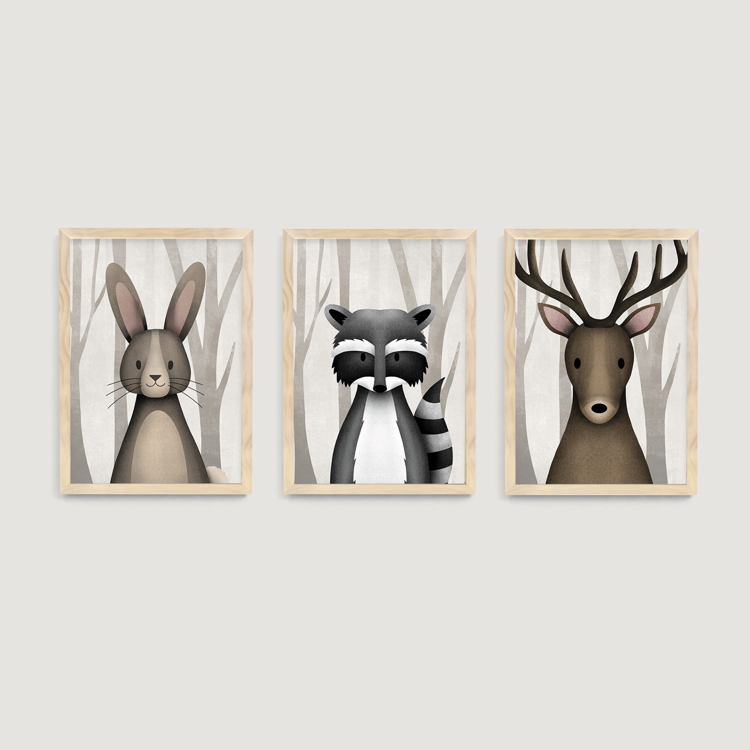 Three framed children and nursery wall art prints of a rabbit, raccoon, and deer in a forest setting - Bluish Nest Art Studio