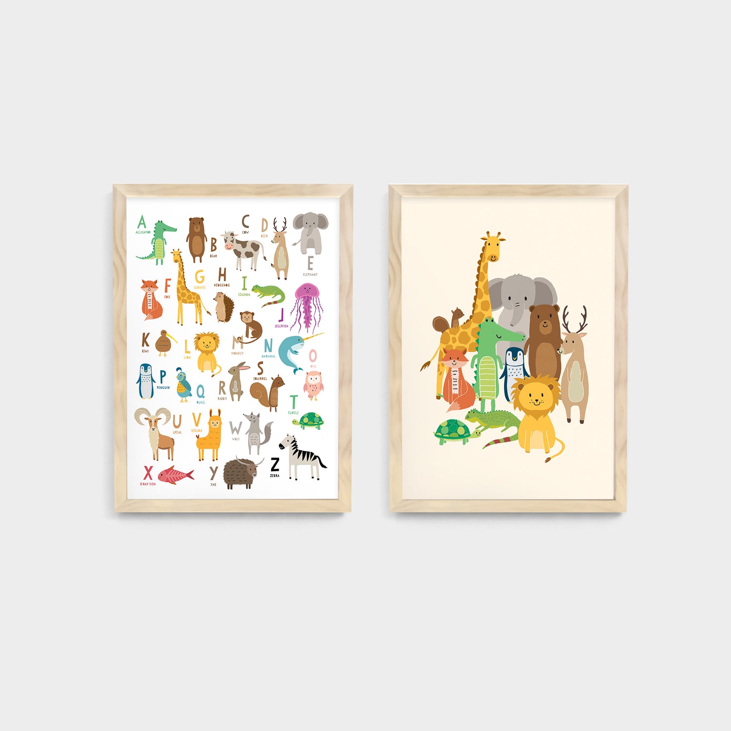 Two framed kids and nursery wall art prints of animas and alphabet letters on a white wall - Bluish Nest Art Studio