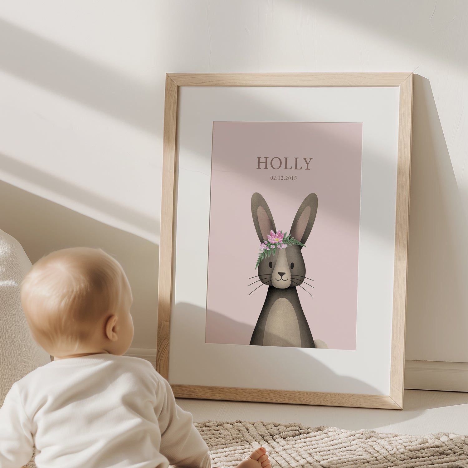 Child holding a custom made, personalised birth nursery kids art print with a raccoon illustration in a kids bedroom - Bluish Nest Art Studio