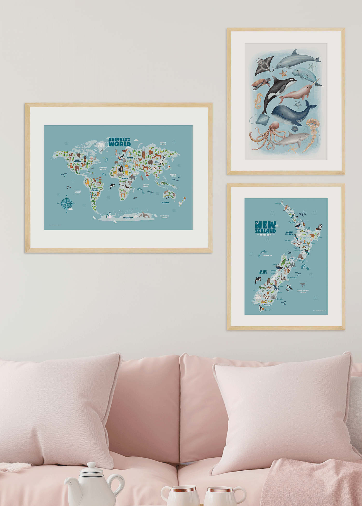 A set of framed nursery children kids wall art prints in lounge consisting of animal world map, sea animals, New Zealand animals map, whale and rainbow illustrations - Bluish Nest Art Studio